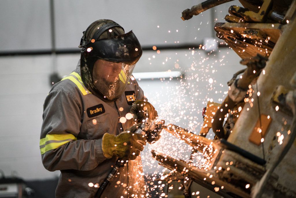 Employee using welding machine