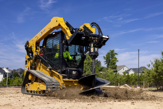 265 Compact Track Loader drilling into ground