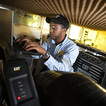 Carter Technician Looking at Computer Running SIS Program